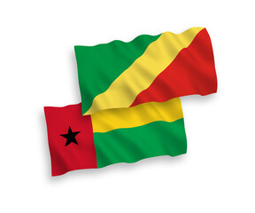 National vector fabric wave flags of Republic of Guinea Bissau and Republic of the Congo isolated on white background. 1 to 2 proportion.