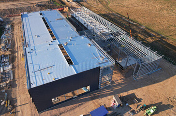 Warehouse Construction from metal structure. Industrial building on light gauge steel framing....