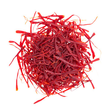 Saffron isolated on white background. Natural dry saffron threads, from crocus flowers. Clipping path. Top view.
