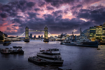 Panorama of the skyline of London with Tower Bridge and Thames River during a cloudy morning, United Kingdom