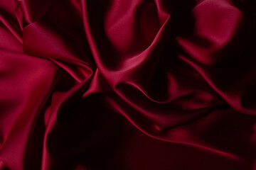 Red smooth cloth folds texture background