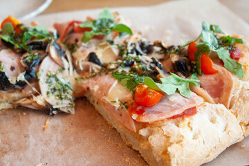 Delicious italian pizza served on wooden table.