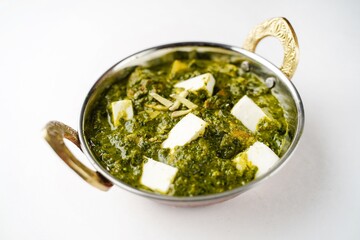 Palak Paneer isolated on white - Indian cottage cheese with spinach, selective focus