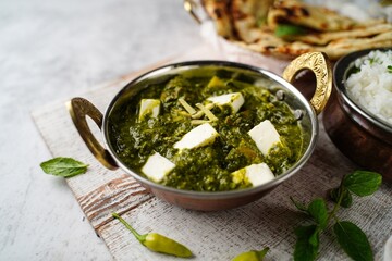 Homemade Palak Paneer roti or Naan and  rice -North Indian vegetarian meal for Diwali