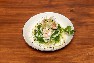 Japanese wakame seaweed salad with shrimp, parsley, poppy seeds and Asian sauce with bean sprouts