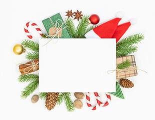 Christmas background with Christmas decoration and sheet of paper in the middle