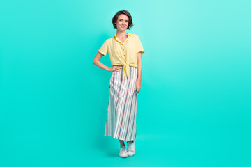 Full length photo of young attractive girl happy positive smile hand on waist isolated over...