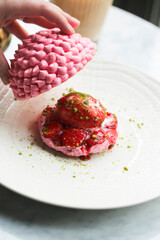 Strawberry meringue dessert with pistachio