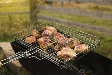Cooking tasty meat on barbecue grill outdoors