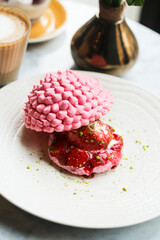 Strawberry meringue dessert with pistachio