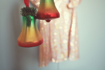 christmas bell, toy, bright and festive with a dress on a background in sequins