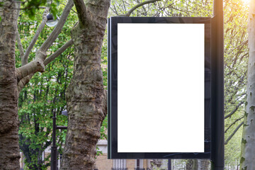 Billboard Mockup in a city with natural landscape. Parisian style hoarding advertisement on a pole...