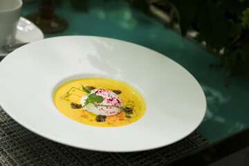 Pumpkin soup with goat cheese