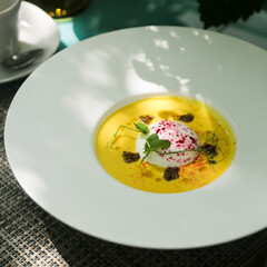 Pumpkin soup with goat cheese