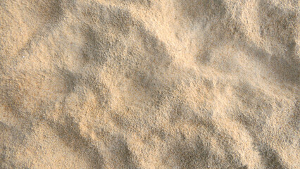 The texture of the sand when it is hit by rain water.