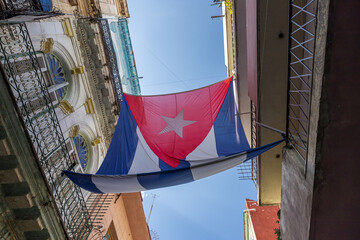 Acosta street of old Havana the Cuban flag