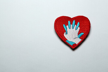 Heart shaped badge with CPR icon isolated on a white background with free space for tex, on the right.