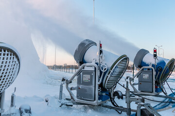 Snow cannons spray artificial ice crystals. Cars make snow. Artificial snowmaking system. Snow...