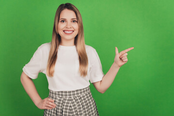 Photo of confident smart positive lady indicate fingers empty space show discount banner wear casual clothes