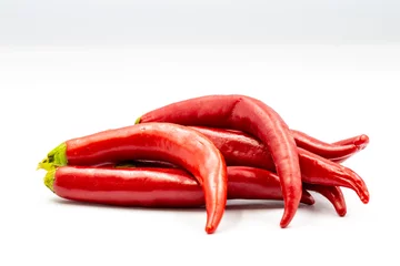 Fotobehang Red hot chili pepper on white background with shadow. close up © enezselvi