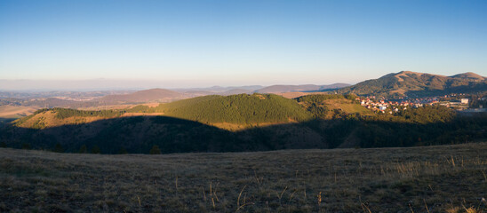 Panoramic view from the Obadovo Brdo viewpoint on the Zlatibor mountain, Serbia to the surrounding hills and the small town of Cajetina