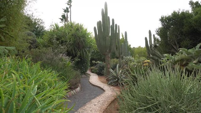 Stone statue of a young girl among the trees - CIRCA 2020 - The beautiful and imaginative Anima Garden in Marrakesh, Morocco