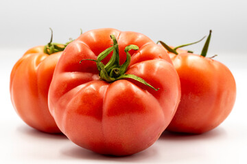 Red Beef Tomato isolated on white background with shadow. Close up