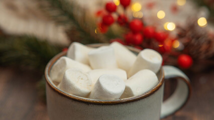coffee with marshmallows in a cup on the background of a Christmas decor , the concept of Christmas