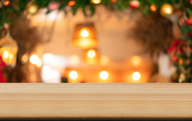 Empty wooden table and blurred Christmas background of abstract in front of coffee shop or restaurant for display of product or for montage