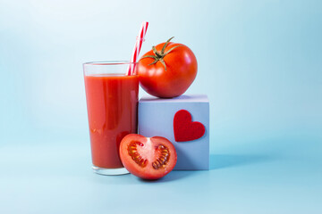 Abstract painting tomato juice with tomatoes, a red heart and a blue podium on a blue background close-up