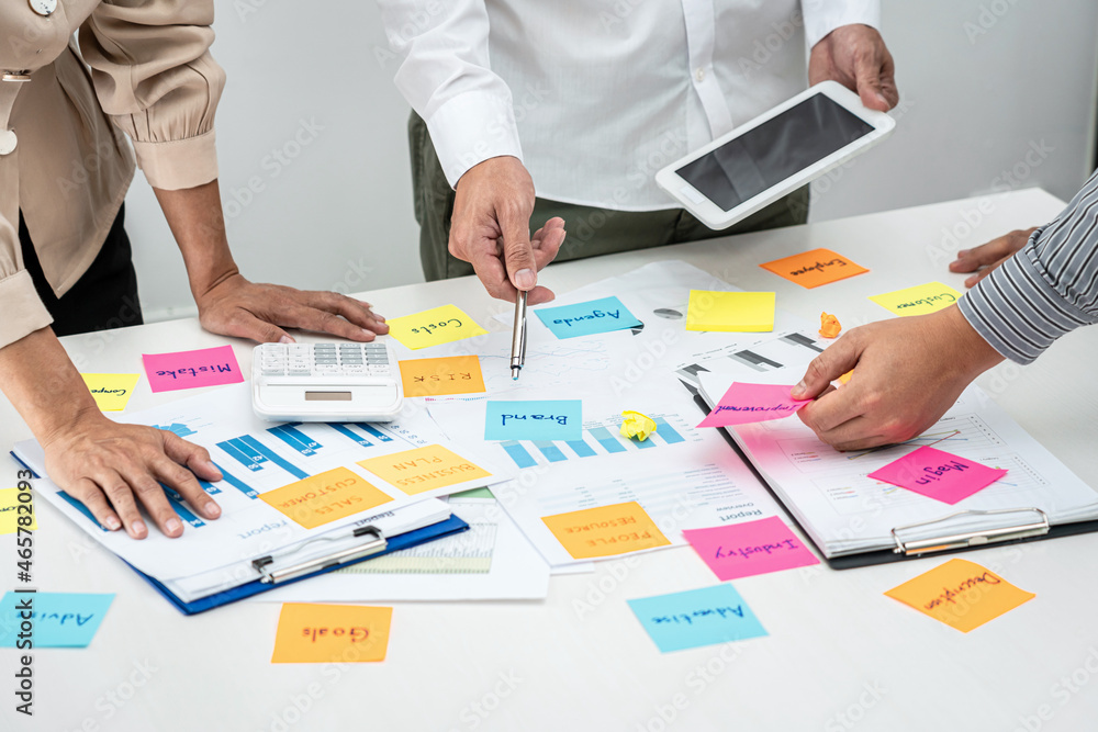Poster business people team, businessman holding tablet to looking for checking data and pointing post it n