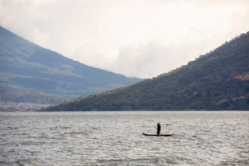 Fototapeta premium fisherman on boat in Guatemala 