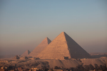 Obraz na płótnie Canvas pyramids of giza at sunset