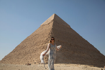 Female traveler exploring pyramids of Giza