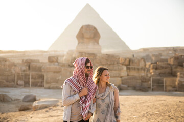 traveling couple at the pyramids of Giza
