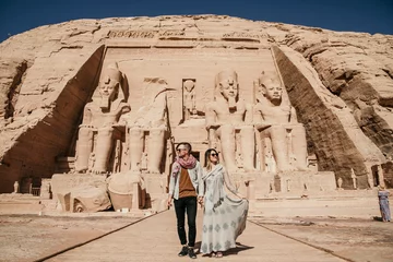 Foto op Plexiglas Traveling Couple exploring Abu Simbel ancient temple in Egypt © Zach