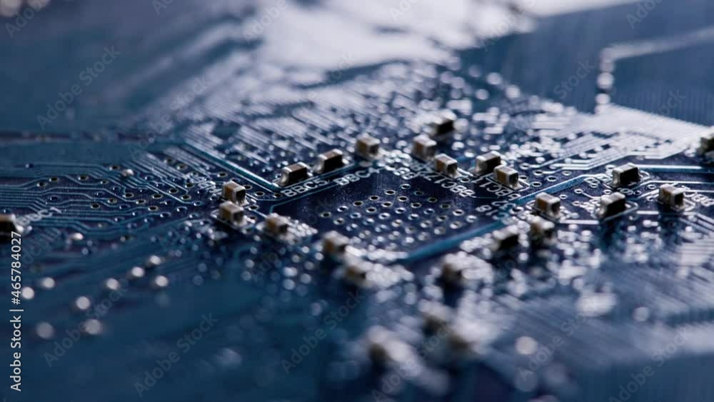 Poster computer electronic circuit board with radial conductor tracks and smd capacitors rotating macro