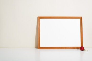 Wooden horizontal picture frame mock up, simple minimal decor design. Portrait frame template with...
