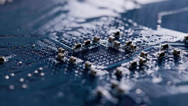 Computer electronic circuit board with radial conductor tracks and SMD capacitors rotating macro