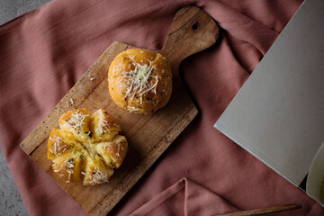 Garlic Cheese Bread (Yugjjog Maneulppang) is Korean Popular Street Food served on the table