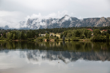 reflection of mountains and mist in Estes park Colorado 
