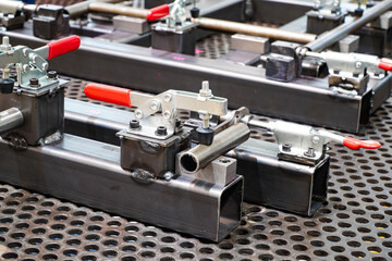 Fototapeta na wymiar Toggle clamp for locking welding machine parts. For clamping workpieces and inspection JIGs.