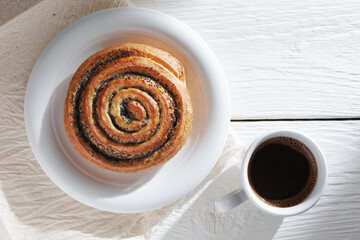 Poppy seed bun and coffee