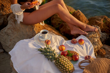 picnic on the beach. woman on sea side relax in the summer. holidays or vacation in warm countries