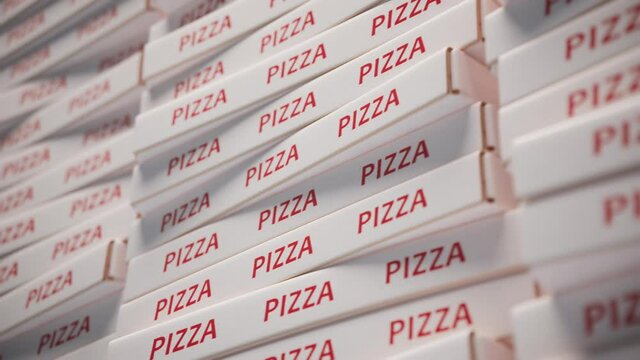 A huge pile of cardboard pizza boxes. Stack of cartons. Fast food packaging.