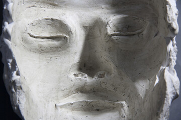 Plaster cast of face. Facial mould with closed eyes. Inside of mask, optical illusion.