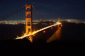 Golden Gate Bridge is ablaze with light during night