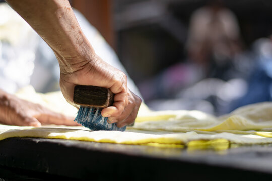 Hands Of A Man With A Brush Washing The Clothes In Dhobi Ghat, Mumbai, India. Indian Labour, Worker Or Labor, Poor And Hard Working. Skill India. Swanidhi, Mudra Loan, Jobs, Migrant.