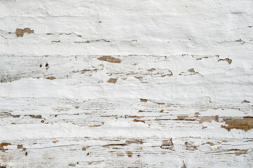 Background from old wooden boards painted white. Photo of boards fitted to each other.