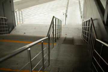 Steel handrails for support when descending the steps.